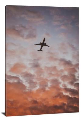 CW6021-aircraft-flying-amongst-orange-clouds-00