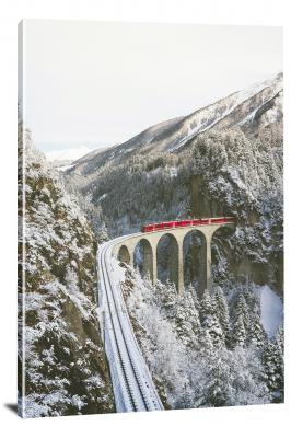 CW6265-trains-red-through-a-wintry-mountain-00